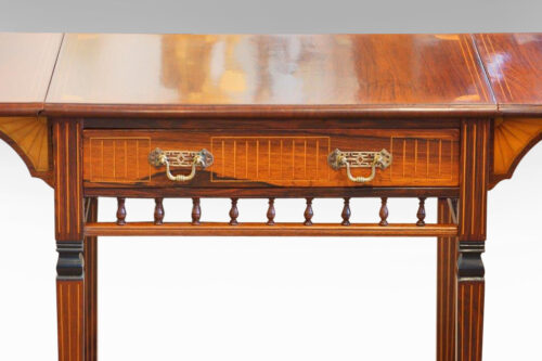 Edwardian inlaid rosewood drop-flap table drawer front