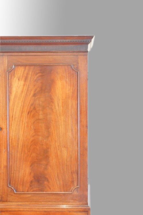 George III mahogany linen press flame panel to doors