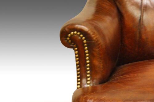 Victorian leather button-back reading chair arm