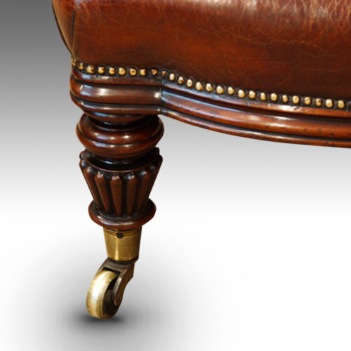 William IV mahogany leather reading chair front leg