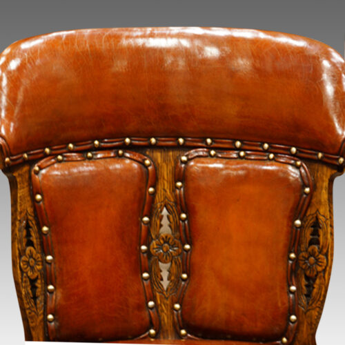 Edwardian oak and leather desk chair top rail