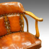 Edwardian oak and leather desk chair arm