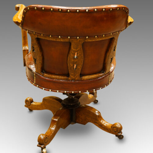 Edwardian oak and leather desk chair rear