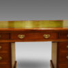 Edwardian walnut pedestal desk central drawer