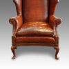 Queen Anne style walnut and leather wing chair seat