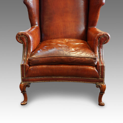 Queen Anne style walnut and leather wing chair seat