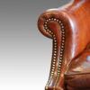 Queen Anne style walnut and leather wing chair arm