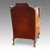 Queen Anne style walnut and leather wing chair rear view