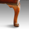 Queen Anne style walnut and leather wing chair rear leg