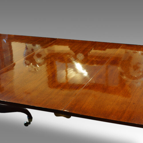 Regency twin pillar mahogany dining table polished surface