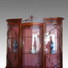 Edwardian claw and ball display cabinet top detail