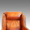 Pair of Edwardian leather club chairs head rest