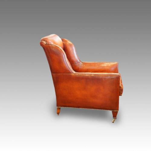 Pair of Edwardian leather club chairs side view