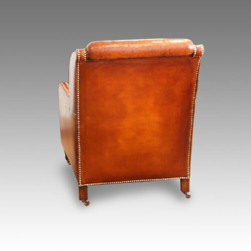 Pair of Edwardian leather club chairs rear