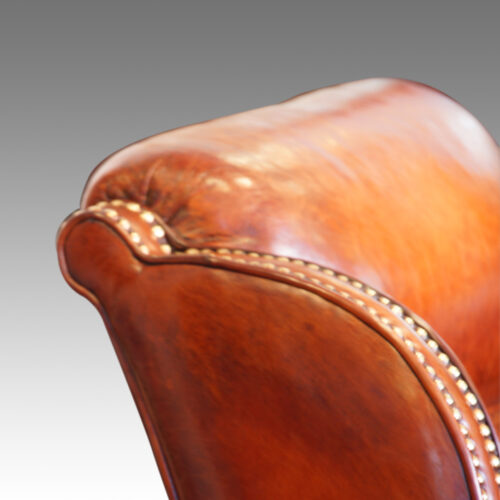 Pair of Edwardian leather club chairs detail