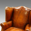 Antique wing-chair leather back
