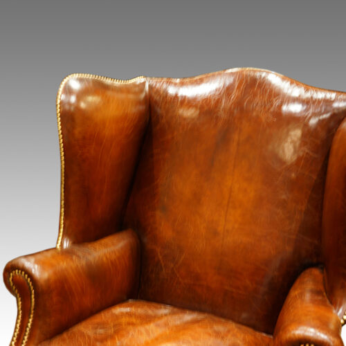 Antique wing-chair leather back