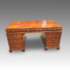 Antique walnut pedestal desk