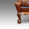 Frong leg of antique wing chair