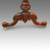 Detail walnut table base