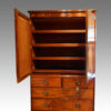 Antique mahogany linen press interior