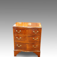 1920's small mahogany serpentine bedside chest