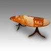 Regency style mahogany twin pillar dining table