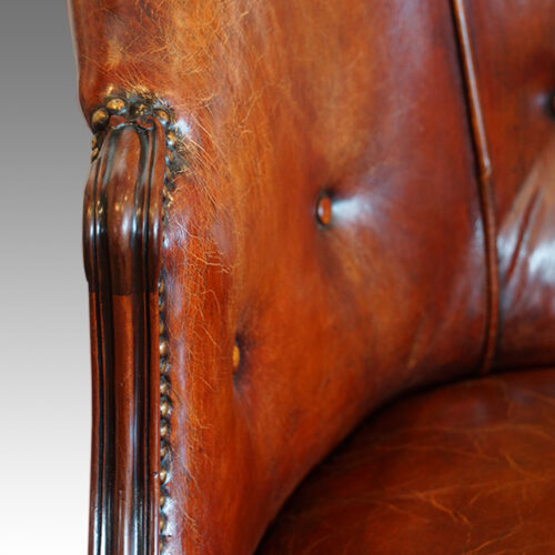 Arm of Antique mahogany tub chair