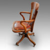Side view of walnut desk chair