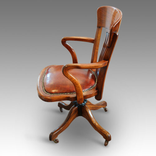 Side view of walnut desk chair