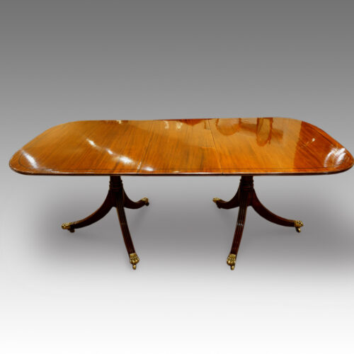 Regency style mahogany twin pillar dining table