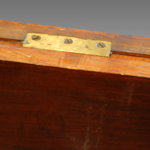 Brass fitting on antique dining table