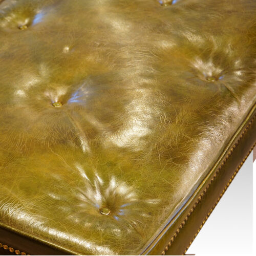 Buttoned leather seat on stool