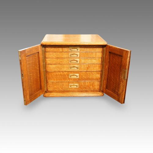 Edwardian oak collectors cabinet