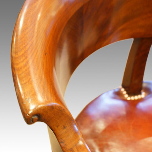 Rolled back of antique desk chair