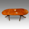 Regency style mahogany twin pillar dining table