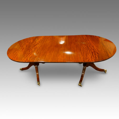 Regency style mahogany twin pillar dining table