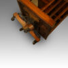 Victorian mahogany revolving bookcase showing the cast iron base