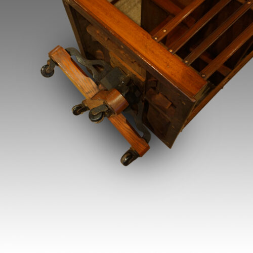 Victorian mahogany revolving bookcase showing the cast iron base