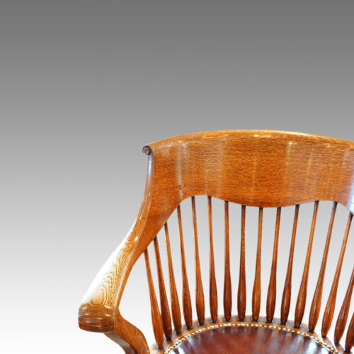 Edwardian oak spindle back revolving desk chair back detail