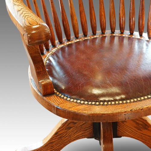 Edwardian oak spindle back revolving desk chair detail