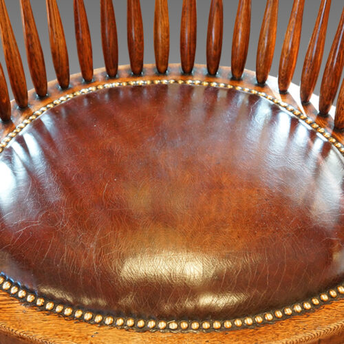 Edwardian oak spindle back revolving desk chair leather seat