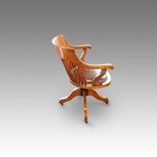 Edwardian oak spindle back revolving desk chair side view