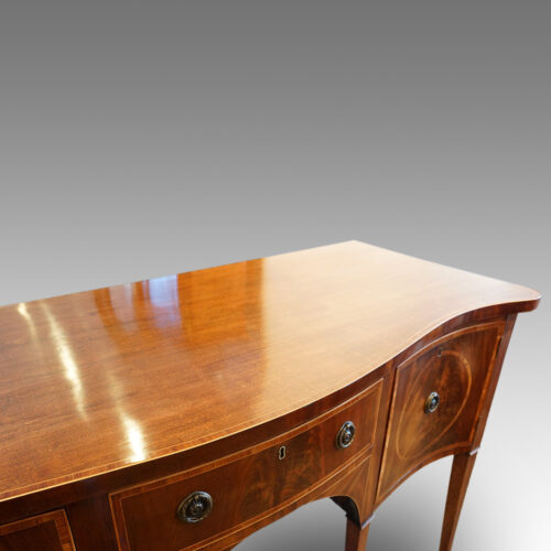 Georgian serpentine mahogany inlaid sideboard rear