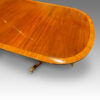 Mahogany triple pillar dining table in the Georgian style, cross-banding