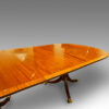 Mahogany triple pillar dining table in the Georgian style, top detail