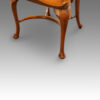 Edwardian oak and leather desk chair,front leg