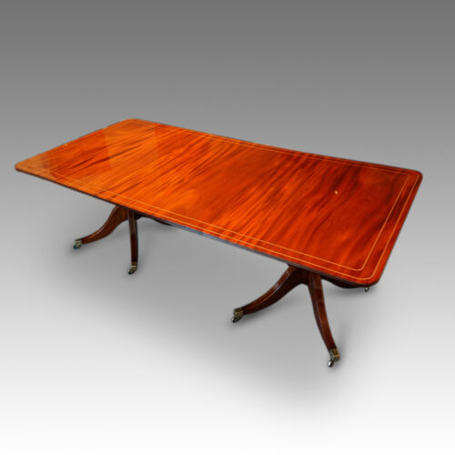 Regency style twin pillar mahogany dining table with line inlay