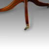 Regency style twin pillar mahogany dining table with line inlay detail base