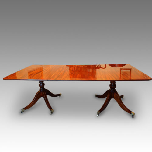 Regency style twin pillar mahogany dining table with line inlay side